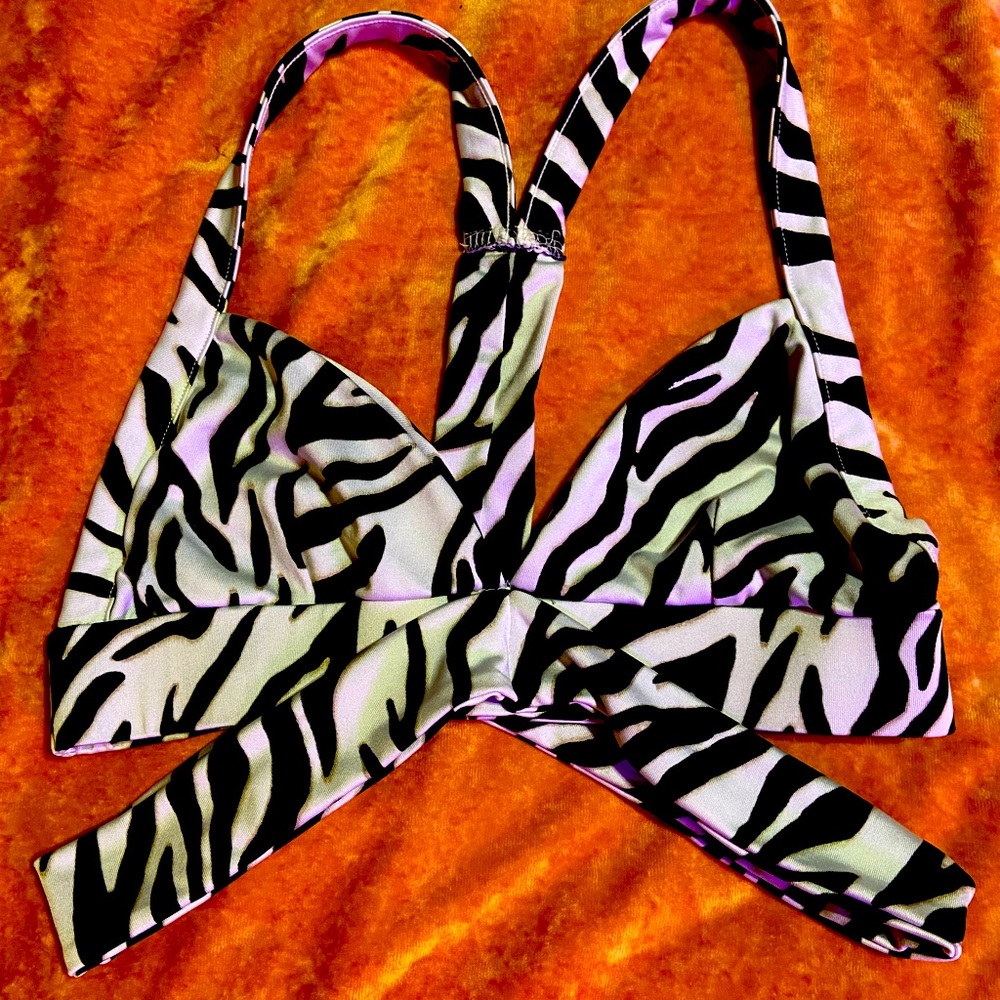 Forever 22 zebra sports bra with wrap around bottom straps. Like new condition.